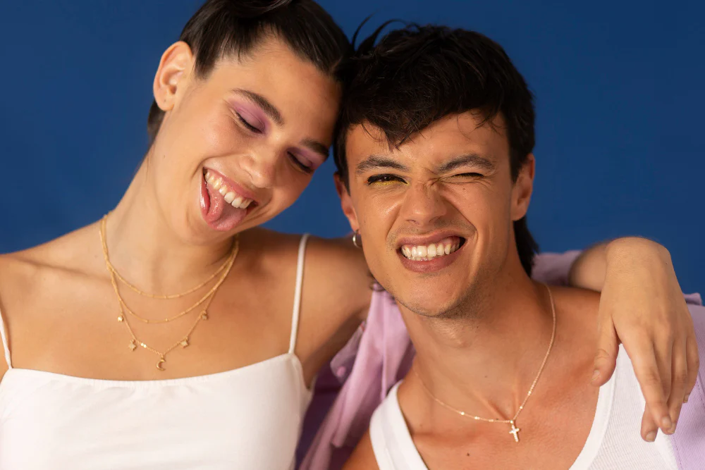 Two smiling adults posing together